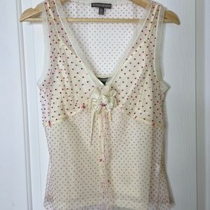 White sleeveless top with pink beads embroidery